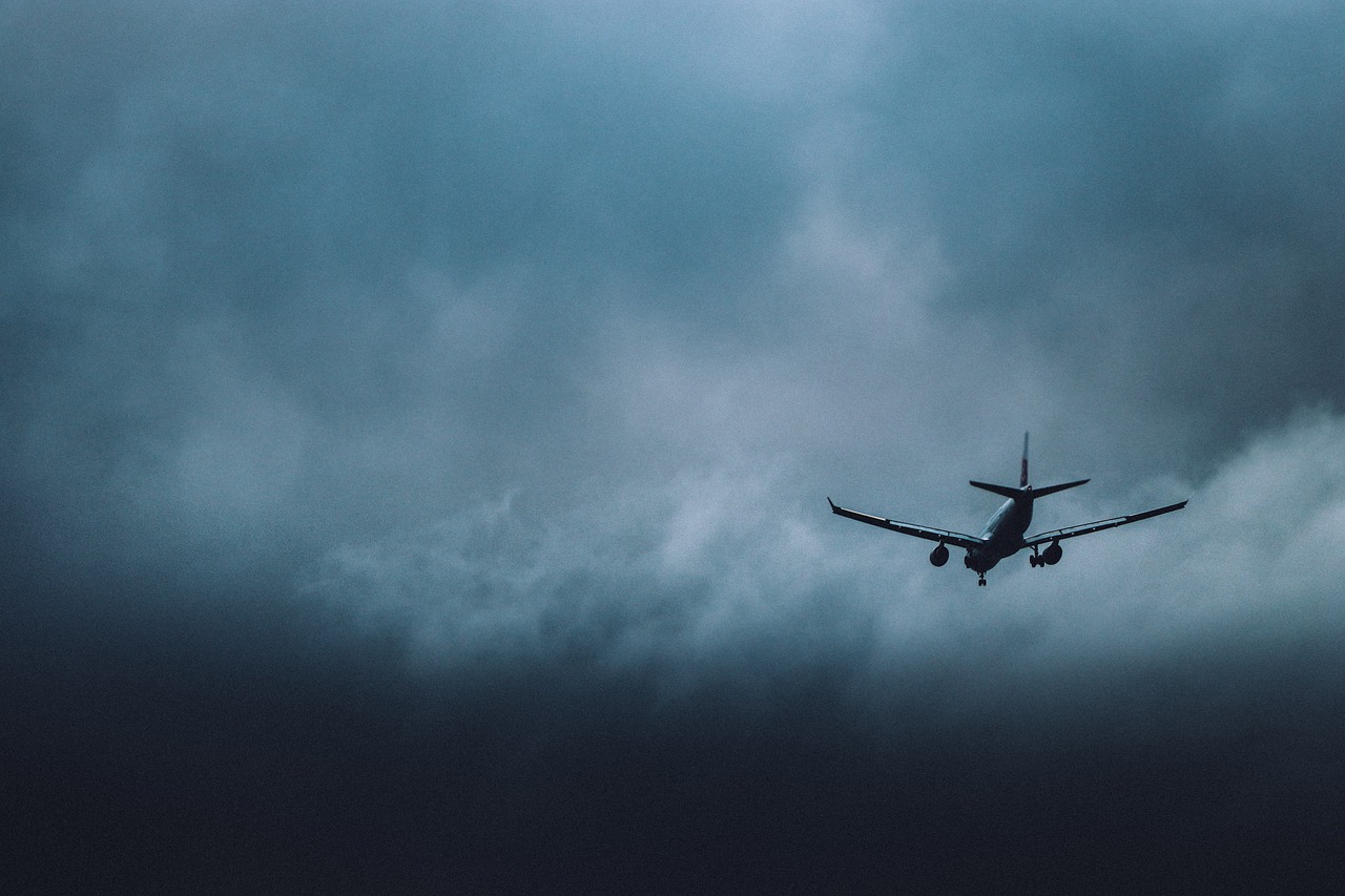 Plane Airplane Storm Clouds  - peterhoangkhanh / Pixabay