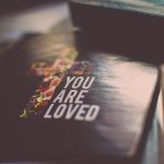 selective focus photography of You Are Loved book