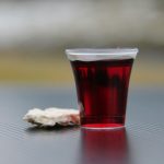 clear drinking glass with red liquid