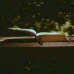 book page on brown wooden table
