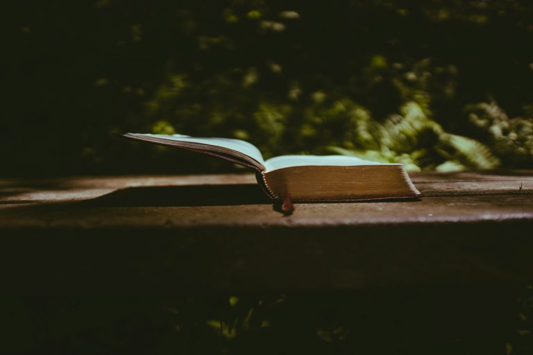 book page on brown wooden table
