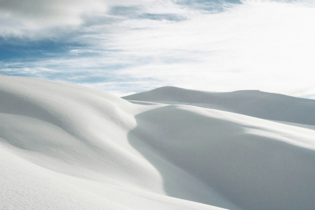 desert under white clouds during daytime