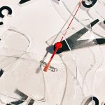 a close up of a clock with a red second hand