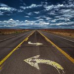 gray asphalt road under blue sky during daytime