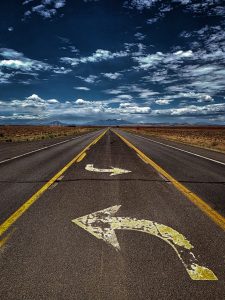 gray asphalt road under blue sky during daytime